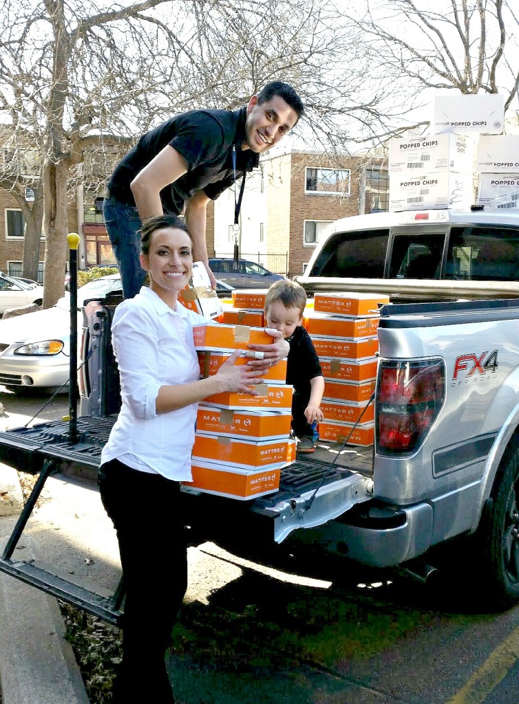 Erin and her husband Anthony pack MatterBoxes into their car, ready for distribution.
